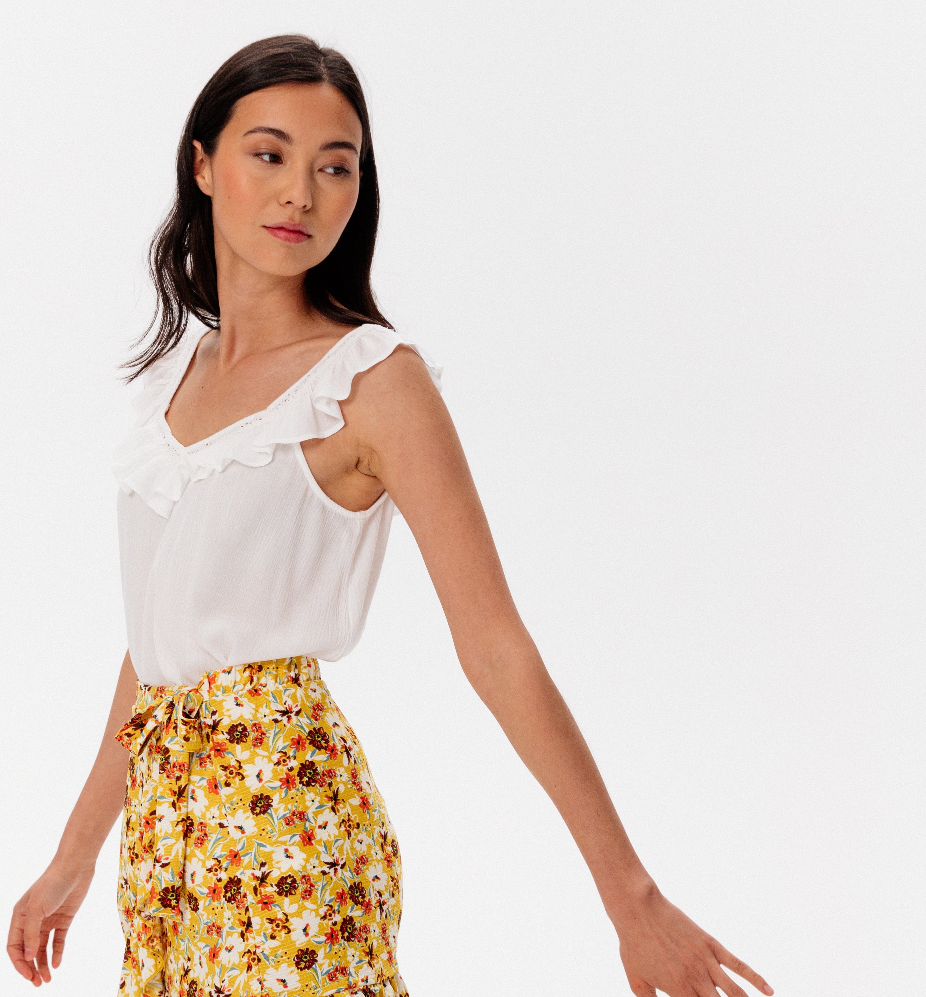 yellow sleeveless top
