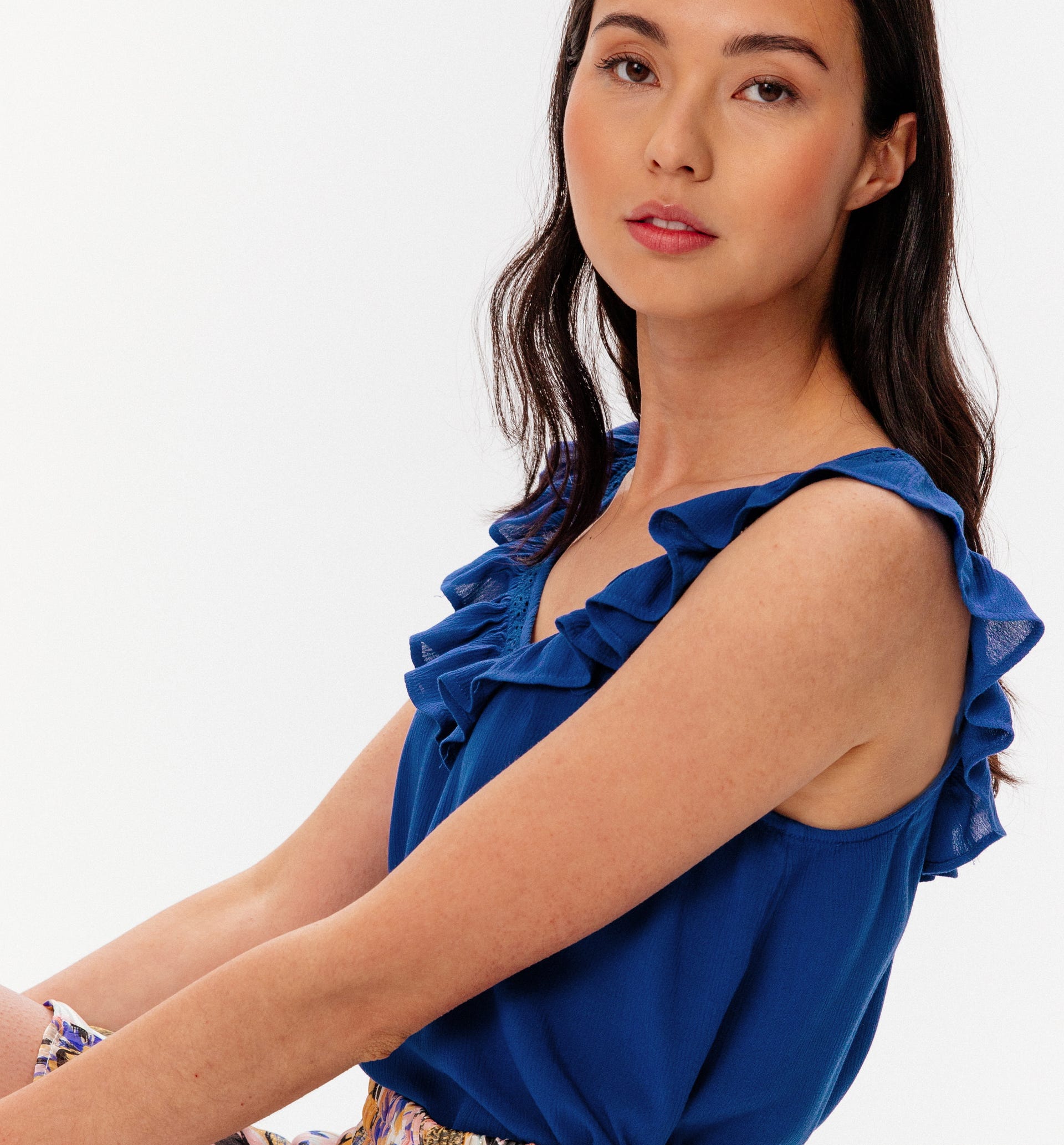 Top with frilly neckline