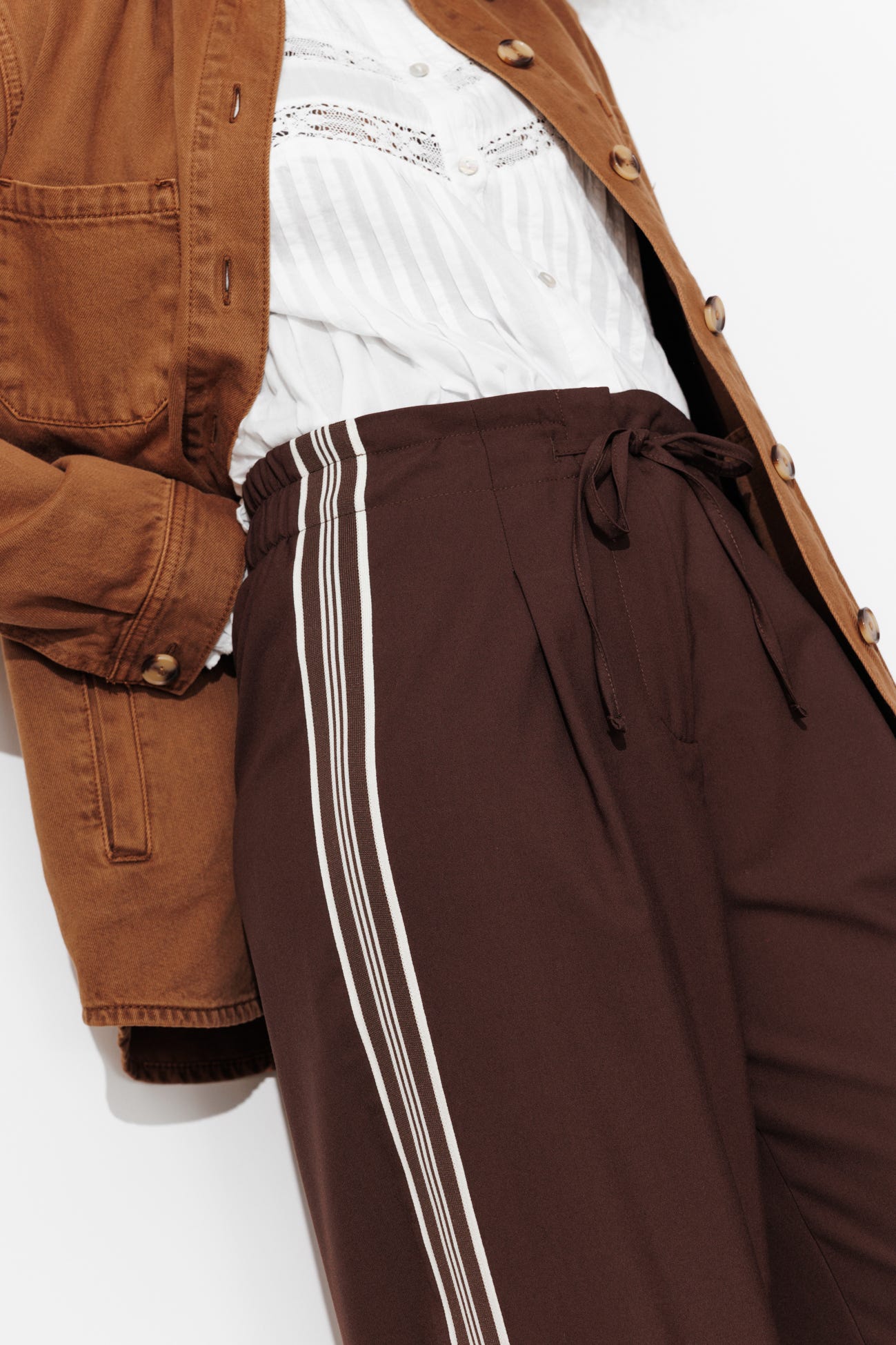 Wide trousers with side bands
