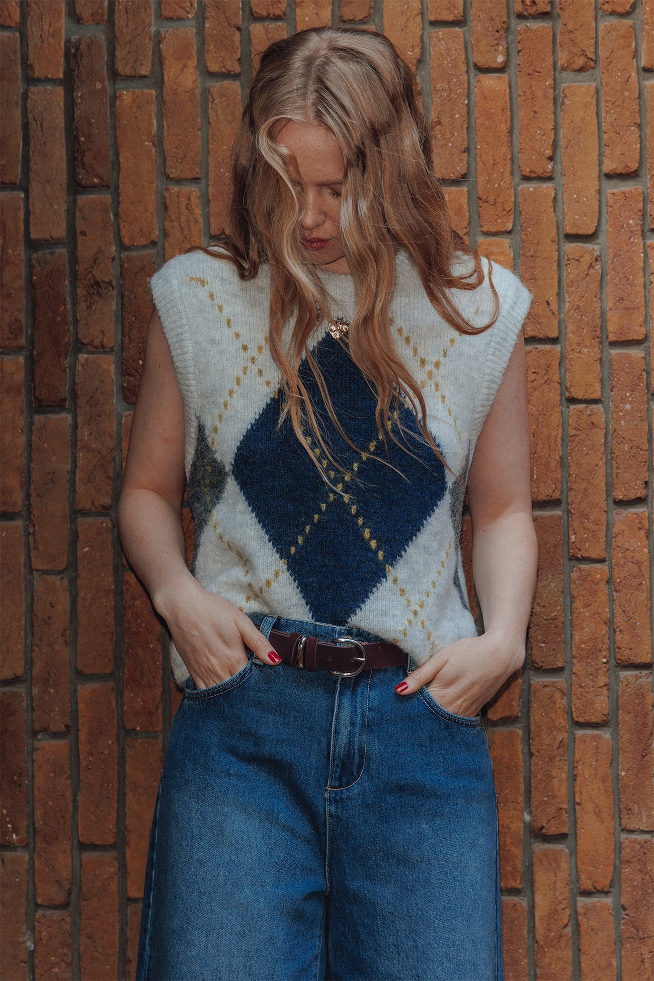 Pull sans manches à carreaux