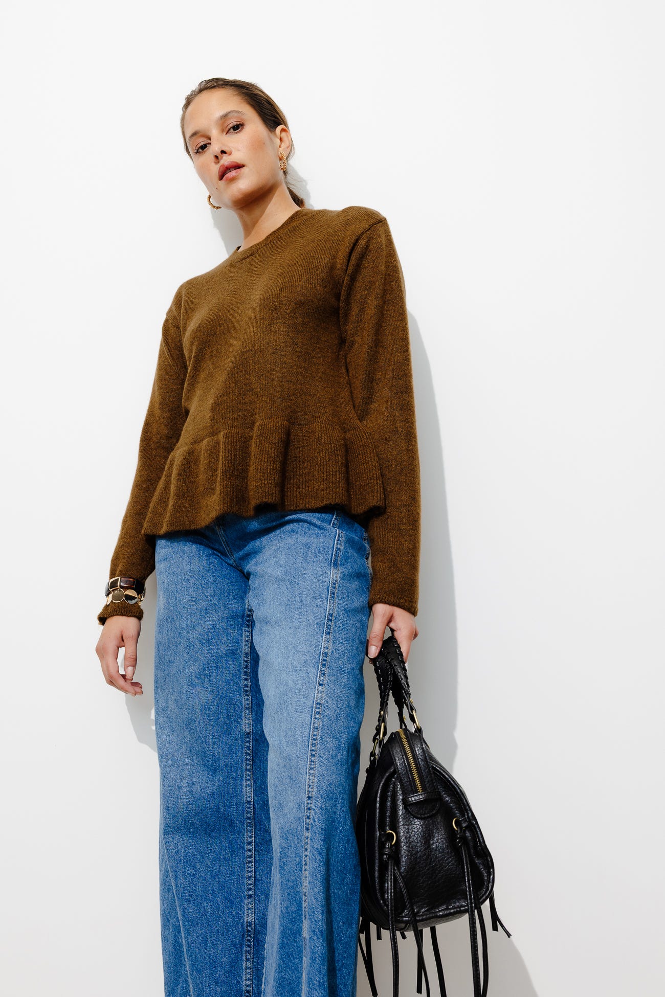 Jumper with wavy peplum waist