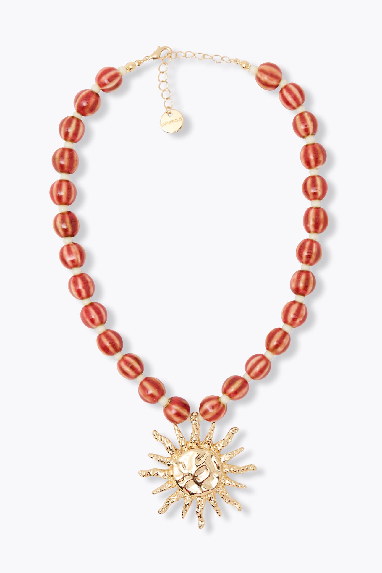 Collier de perles et soleil