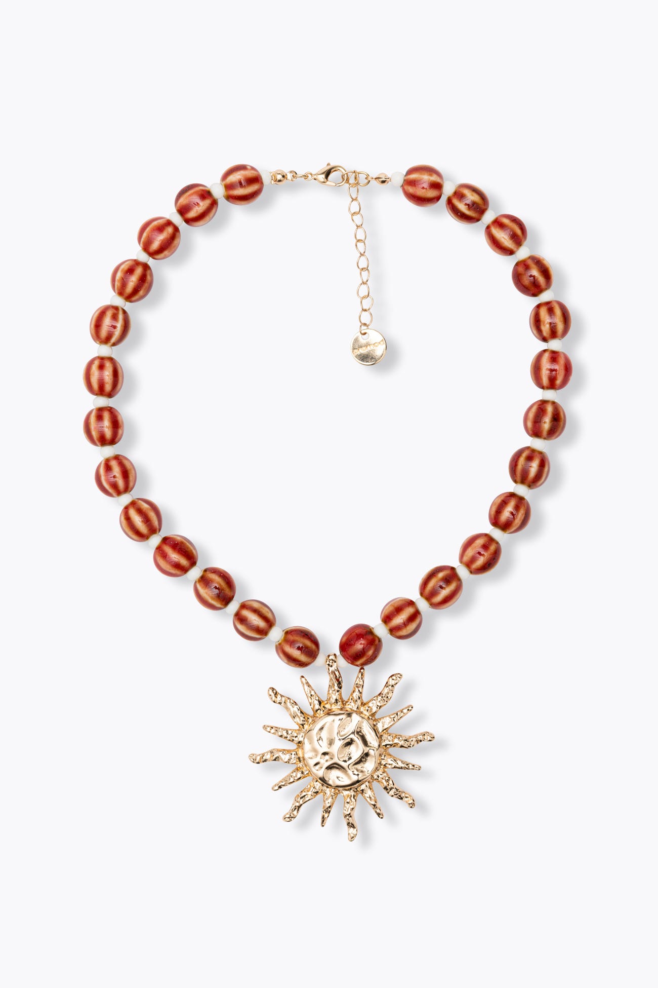 Collier de perles et soleil