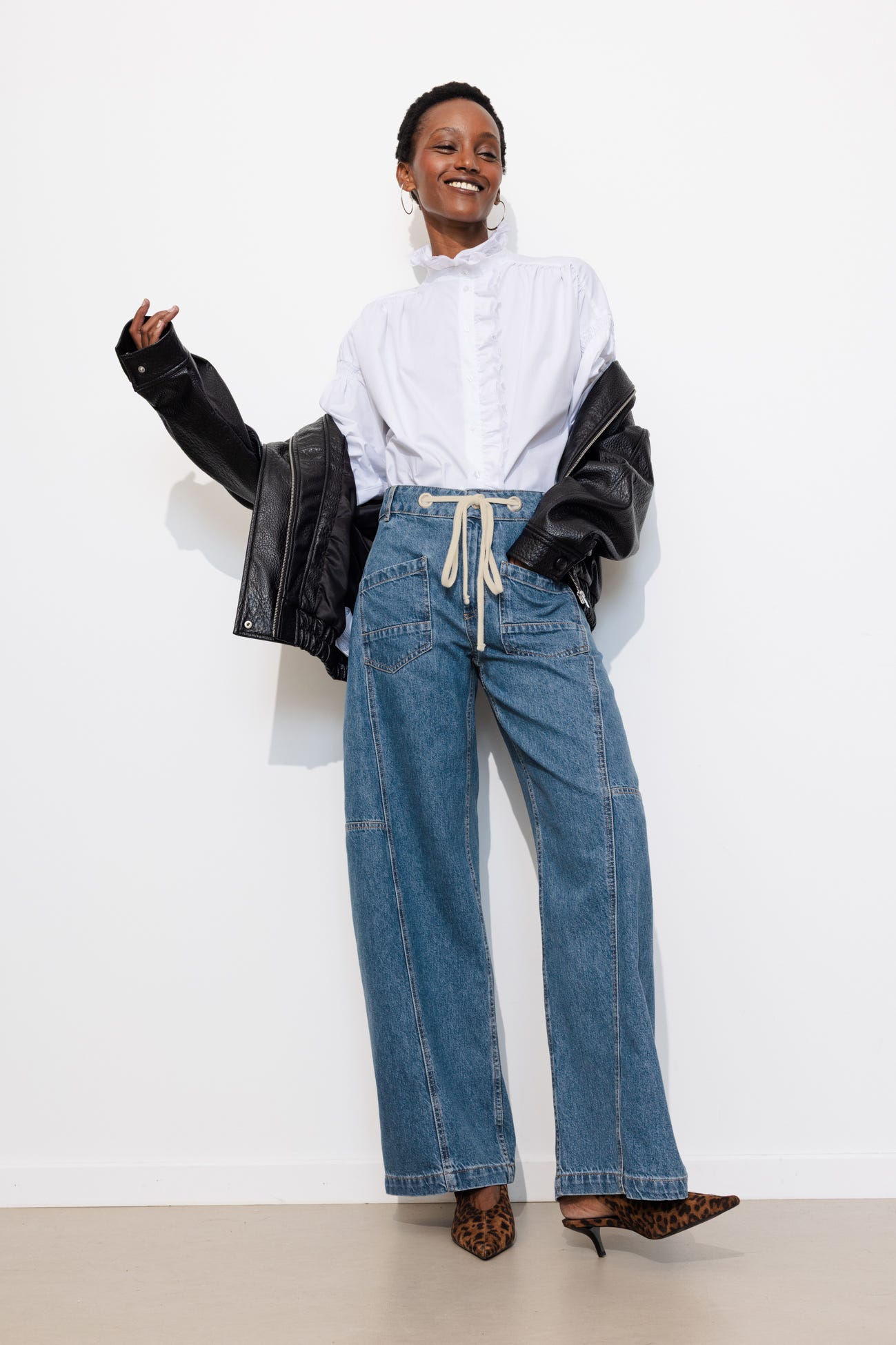 Jean large à oeillets Femme